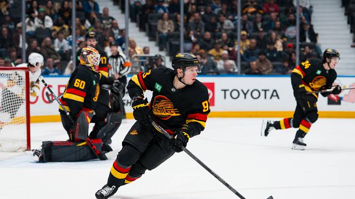 Apr 7, 2026; Vancouver, British Columbia, CAN; Vancouver Canucks forward Marco Rossi (93) handles the puck against the Vegas Golden Knights in the third period at Rogers Arena. Mandatory Credit: Bob Frid-Imagn Images