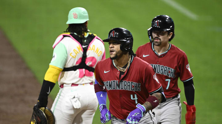 Jun 6, 2024; San Diego, California, USA; Arizona Diamondbacks second baseman Ketel Marte (4), center, and Corbin Carroll (7)  score after Marte hit a two-run home run during the seventh inning against the San Diego Padres at Petco Park. Mandatory Credit: Denis Poroy-USA TODAY Sports at Petco Park. 
