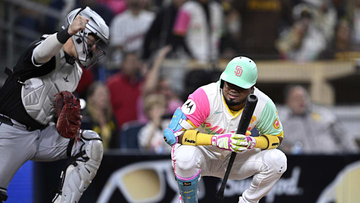 Sep 20, 2024; San Diego, California, USA; San Diego Padres designated hitter Luis Arraez (4) and Chicago White Sox catcher Korey Lee (26) react after Arraez lined out into a double play to end the ninth inning at Petco Park. Mandatory Credit: Orlando Ramirez-Imagn Images