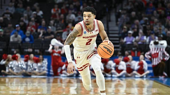 Mar 19, 2026; Portland, OR, USA; Wisconsin Badgers guard Nick Boyd (2) dribbles against the High Point Panthers during the first half of a first round game of the men's 2026 NCAA Tournament at Moda Center. Mandatory Credit: Craig Strobeck-Imagn Images