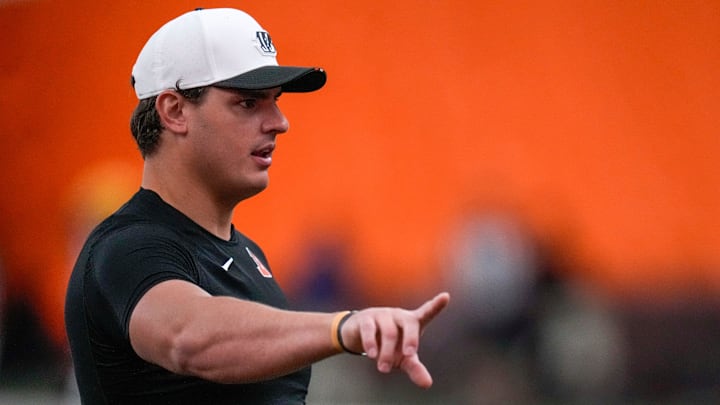 Cincinnati Bengals defensive end Trey Hendrickson (91) assists with drills during a preseason training camp practice in downtown Cincinnati on Thursday, July 31, 2025.