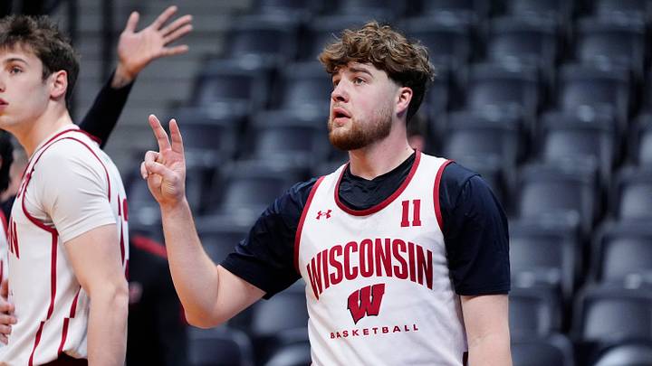 Mar 19, 2025; Denver, CO, USA; Wisconsin Badgers guard Max Klesmit (11) warms up during practice at Ball Arena. Mandatory Credit: Ron Chenoy-Imagn Images