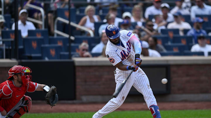Jul 23, 2025; New York City, New York, USA; New York Mets outfielder Starling Marte (6) hits a double against the Los Angeles Angels during the fifth inning at Citi Field. Mandatory Credit: John Jones-Imagn Images
