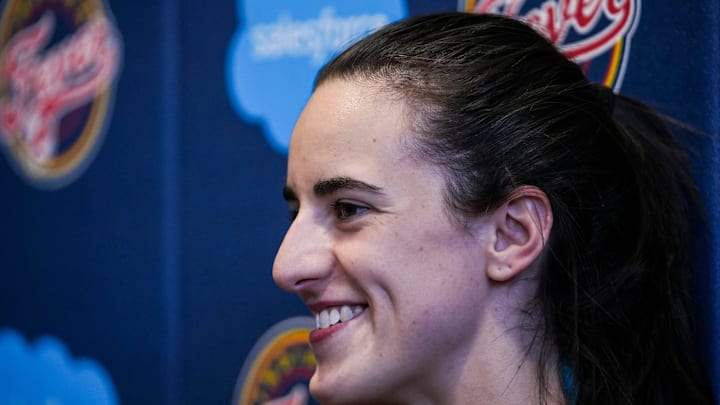 Indiana Fever guard Caitlin Clark (22) smiles while answering a question Tuesday, Sept. 17, 2024, after an Indiana Fever practice at Gainbridge Fieldhouse in Indianapolis.