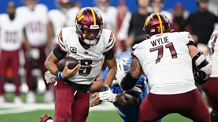 Washington Commanders quarterback Jayden Daniels scrambles out of the pocket against the Detroit Lions.