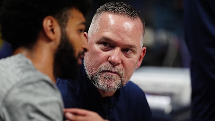 Denver Nuggets head coach Michael Malone listens to guard Jamal Murray (27) before the game against the Miami Heat at Ball Arena. Denver Nuggets head coach Michael Malone listens to guard Jamal Murray (27) before the game against the Miami Heat at Ball Arena.