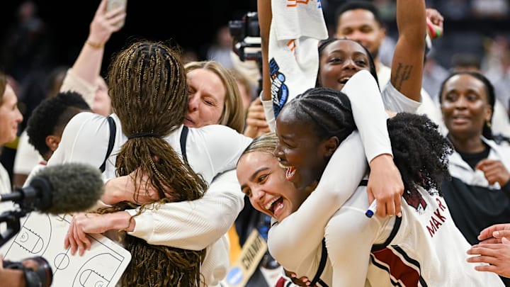 Mar 30, 2026; Sacramento, CA, USA; South Carolina Gamecocks guard Tessa Johnson (5) and guard Agot Makeer (44) celebrate after defeating the Texas Christian University Horned Frogs in an Elite Eight game in the Sacramento Regional 4 of the women's 2026 NCAA Tournament at the Golden 1 Center. Mandatory Credit: Ed Szczepanski-Imagn Images Mar 30, 2026; Sacramento, CA, USA; South Carolina Gamecocks guard Tessa Johnson (5) and guard Agot Makeer (44) celebrate after defeating the Texas Christian University Horned Frogs in an Elite Eight game in the Sacramento Regional 4 of the women's 2026 NCAA Tournament at the Golden 1 Center. Mandatory Credit: Ed Szczepanski-Imagn Images