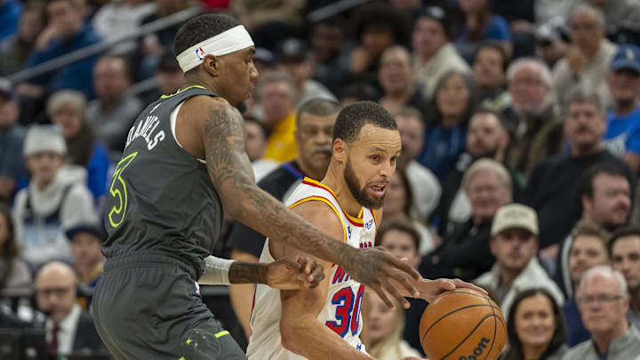 Jan 15, 2025; Minneapolis, Minnesota, USA; Golden State Warriors guard Stephen Curry (30) dribbles the ball against Minnesota Timberwolves forward Jaden McDaniels (3) in the second half at Target Center. Mandatory Credit: Jesse Johnson-Imagn Images Jan 15, 2025; Minneapolis, Minnesota, USA; Golden State Warriors guard Stephen Curry (30) dribbles the ball against Minnesota Timberwolves forward Jaden McDaniels (3) in the second half at Target Center. Mandatory Credit: Jesse Johnson-Imagn Images