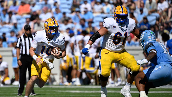 Oct 5, 2024; Chapel Hill, North Carolina, USA; Pittsburgh Panthers quarterback Eli Holstein (10) runs with the ball in the first quarter at Kenan Memorial Stadium. Mandatory Credit: Bob Donnan-Imagn Images