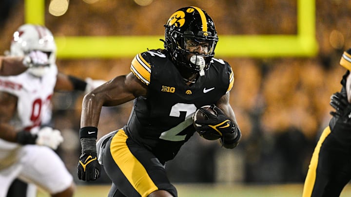 Nov 2, 2024; Iowa City, Iowa, USA; Iowa Hawkeyes running back Kaleb Johnson (2) runs the ball against the Wisconsin Badgers during the second quarter at Kinnick Stadium.