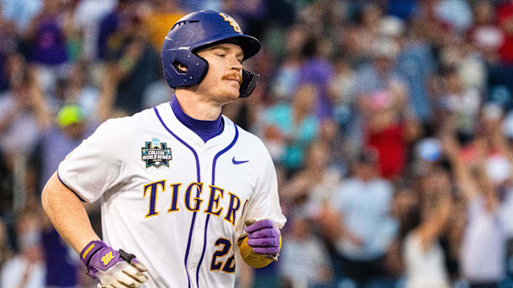 Jun 18, 2025; Omaha, Neb, USA; LSU Tigers first baseman Jared Jones (22) runs the bases after hitting a solo home run against the Arkansas Razorbacks during the eighth inning at Charles Schwab Field. Mandatory Credit: Dylan Widger-Imagn Images