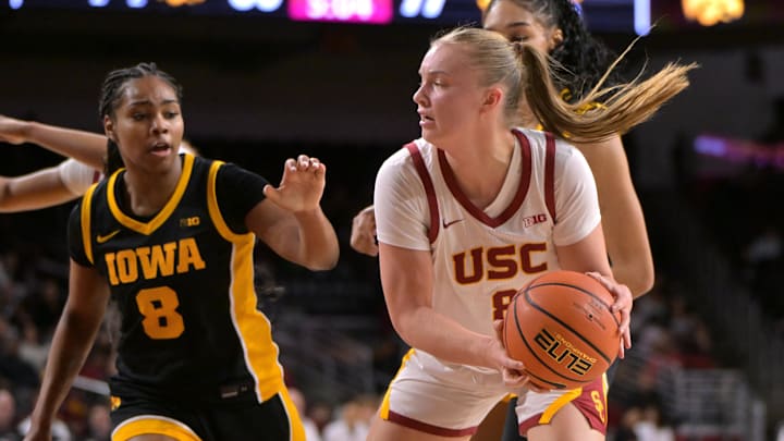 Jan 29, 2026; Los Angeles, California, USA; USC Trojans forward Gerda Raulusaityte (8) rebounds away from Iowa Hawkeyes guard Journey Houston (8) in the second half at Galen Center. Mandatory Credit: Jayne Kamin-Oncea-Imagn Images
