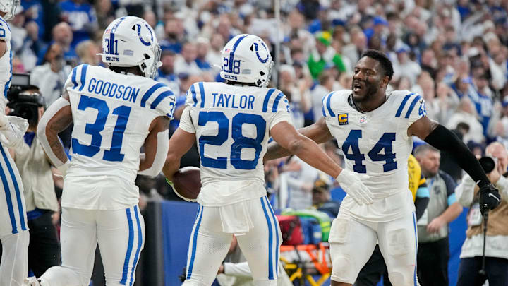 Indianapolis Colts running back Jonathan Taylor (28) celebrates with Indianapolis Colts running back Tyler Goodson (31) and Indianapolis Colts linebacker Zaire Franklin (44) after rushing for a touchdown Sunday, Dec. 22, 2024, during a game against the Tennessee Titans at Lucas Oil Stadium in Indianapolis.