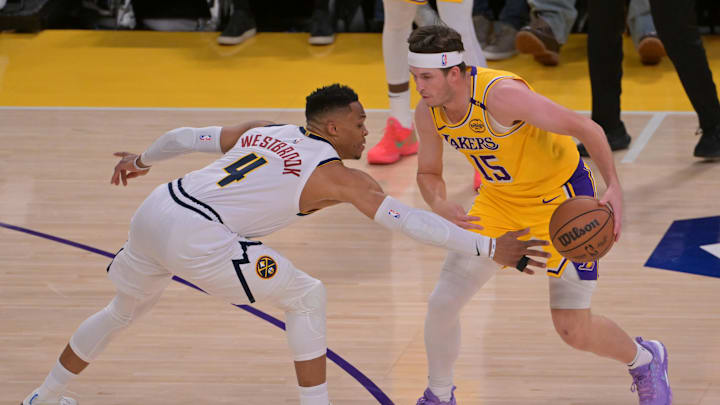 Mar 19, 2025; Los Angeles, California, USA; Denver Nuggets guard Russell Westbrook (4) defends Los Angeles Lakers guard Austin Reaves (15) in the first half at Crypto.com Arena. Mandatory Credit: Jayne Kamin-Oncea-Imagn Images Mar 19, 2025; Los Angeles, California, USA; Denver Nuggets guard Russell Westbrook (4) defends Los Angeles Lakers guard Austin Reaves (15) in the first half at Crypto.com Arena. Mandatory Credit: Jayne Kamin-Oncea-Imagn Images