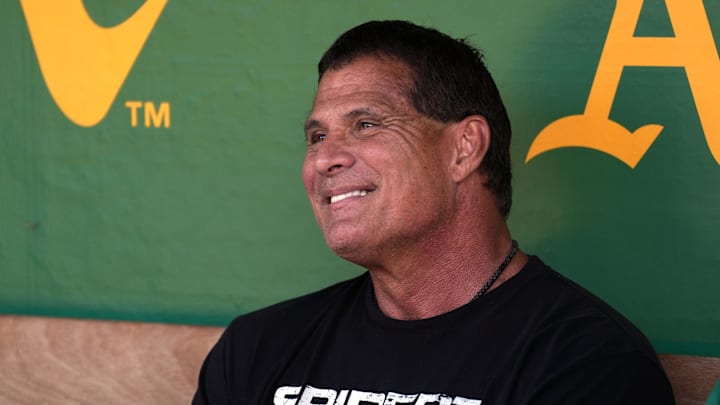 Oakland Athletics former outfielder Jose Canseco sits in the dugout before the game against the San Francisco Giants at Oakland-Alameda County Coliseum. Mandatory Credit: Darren Yamashita-Imagn Images