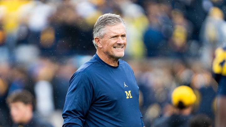 Michigan Wolverines head coach Kyle Whittingham smiles as he observes warmups ahead of a game against UTEP at Michigan Stadium in Ann Arbor on Saturday, Sept. 19, 2026. Michigan Wolverines head coach Kyle Whittingham smiles as he observes warmups ahead of a game against UTEP at Michigan Stadium in Ann Arbor on Saturday, Sept. 19, 2026.