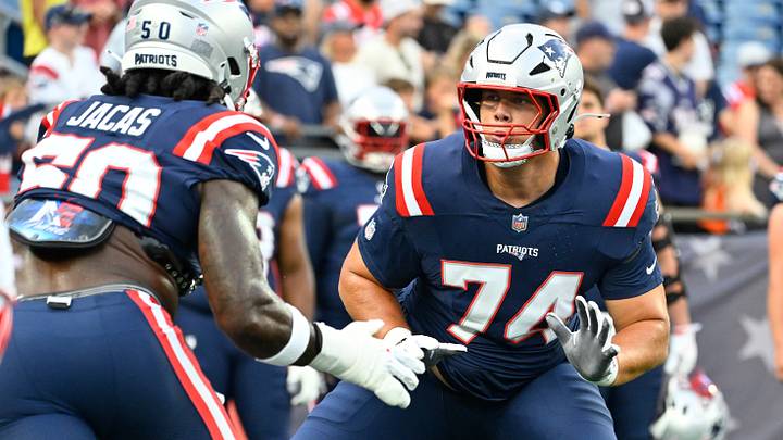 Aug 13, 2026; Foxborough, Massachusetts, USA; New England Patriots offensive tackle Caleb Lomu (74) warms up with linebacker Gabe Jacas (50) before a game against the Indianapolis Colts at Gillette Stadium. Mandatory Credit: Eric Canha-Imagn Images