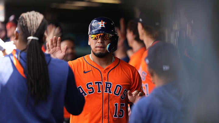 Jul 3, 2025; Denver, Colorado, USA; Houston Astros third baseman Isaac Paredes (15) celebrates scoring in the seventh inning against the Colorado Rockies at Coors Field. Mandatory Credit: Ron Chenoy-Imagn Images
