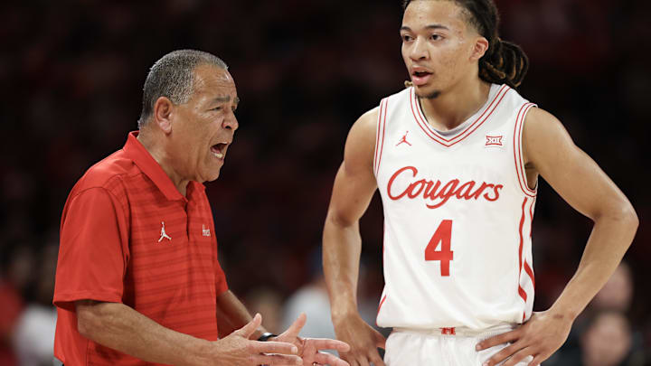 Feb 21, 2026; Houston, Texas, USA;  Houston Cougars head coach Kelvin Sampson talks with guard Kingston Flemings (4) while playing against the Arizona Wildcats in the first half at Fertitta Center. Mandatory Credit: Thomas Shea-Imagn Images