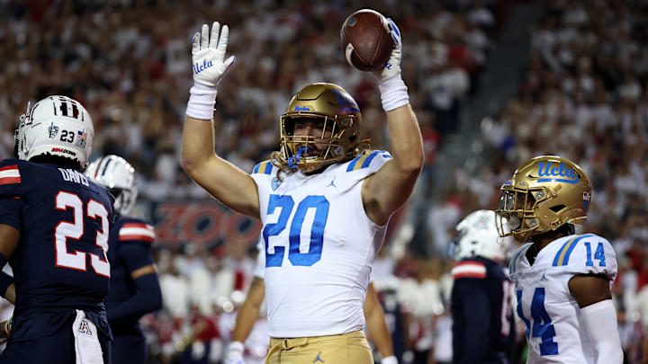 Nov 4, 2023; Tucson, Arizona, USA; UCLA Bruins running back Carsen Ryan #20 celebrates a touchdown against the Arizona Wildcats during the first half at Arizona Stadium. Mandatory Credit: Zachary BonDurant-Imagn Images