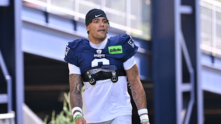 Jul 28, 2025; Foxborough, MA, USA; New England Patriots cornerback Christian Gonzalez (0) heads to the practice fields for training camp at Gillette Stadium. Mandatory Credit: Eric Canha-Imagn Images