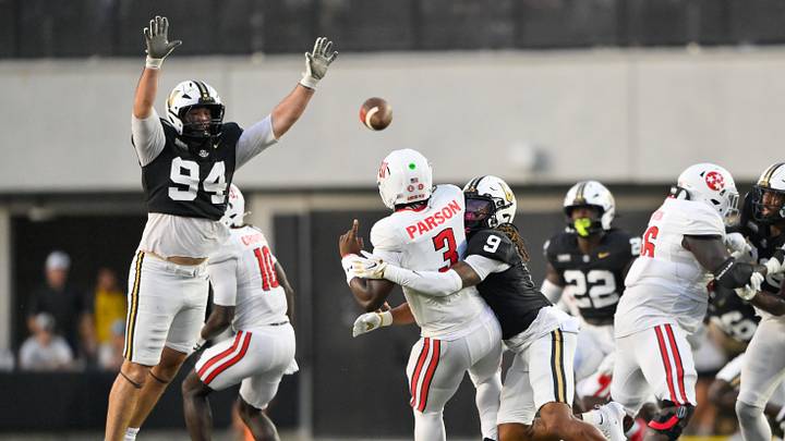 Sep 5, 2026; Nashville, Tennessee, USA;  Austin Peay Governors quarterback Chris Parson (3) throws a pass against Vanderbilt Commodores safety Jalen Gilbert (9) and defensive lineman Bradley Mann (94) during the first half at FirstBank Stadium.  Mandatory Credit: Steve Roberts-Imagn Images