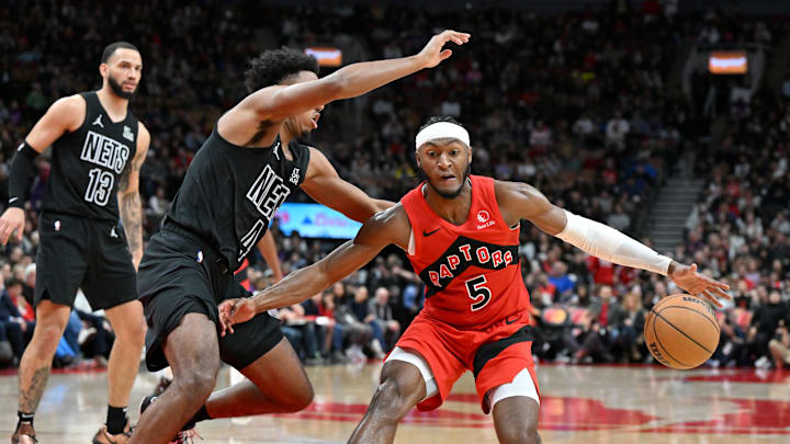 Jan 1, 2025; Toronto, Ontario, CAN; Toronto Raptors guard Immanuel Quickley (5) dribbles the ball as Brooklyn Nets guard Reece Beekman (4) defends in the second half at Scotiabank Arena. Mandatory Credit: Dan Hamilton-Imagn Images Jan 1, 2025; Toronto, Ontario, CAN; Toronto Raptors guard Immanuel Quickley (5) dribbles the ball as Brooklyn Nets guard Reece Beekman (4) defends in the second half at Scotiabank Arena. Mandatory Credit: Dan Hamilton-Imagn Images