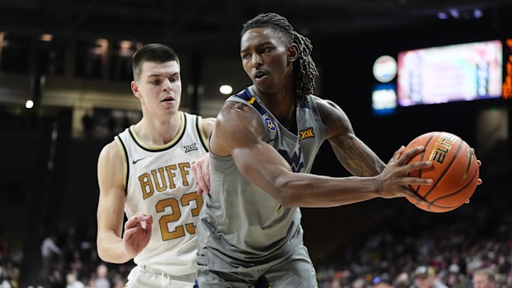 Jan 12, 2025; Boulder, Colorado, USA; Colorado Buffaloes forward Andrej Jakimovski (23) defends on West Virginia Mountaineers guard Javon Small (7) in the second half at CU Events Center. Jan 12, 2025; Boulder, Colorado, USA; Colorado Buffaloes forward Andrej Jakimovski (23) defends on West Virginia Mountaineers guard Javon Small (7) in the second half at CU Events Center.