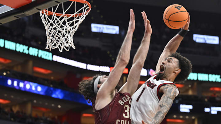 Louisville is a home favorite against Virginia on Tuesday night.