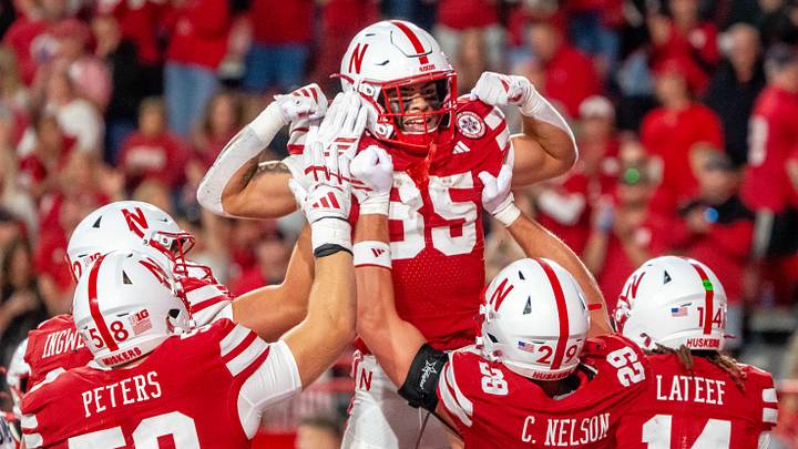 Mekhi Nelson is hoisted by teammates after scoring a touchdown against Akron last season.