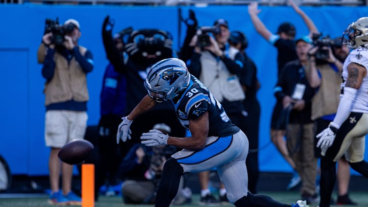 Nov 3, 2024; Charlotte, North Carolina, USA; Carolina Panthers running back Chuba Hubbard (30) spikes the ball after scoring against the New Orleans Saints during the fourth quarter at Bank of America Stadium. Mandatory Credit: Scott Kinser-Imagn Images