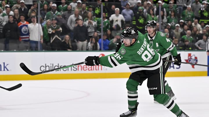 Nov 4, 2025; Dallas, Texas, USA; Dallas Stars right wing Mikko Rantanen (96) shoots the puck in the Edmonton Oilers zone during the overtime period at the American Airlines Center. Mandatory Credit: Jerome Miron-Imagn Images