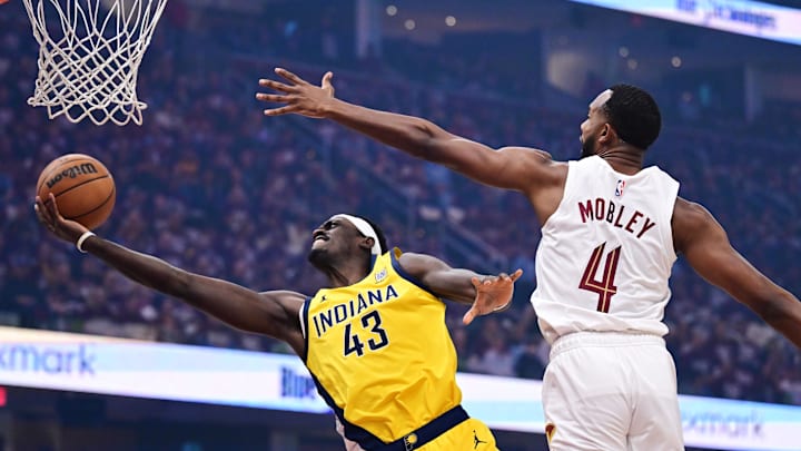 May 4, 2025; Cleveland, Ohio, USA; Indiana Pacers forward Pascal Siakam (43) drives to the basket against Cleveland Cavaliers forward Evan Mobley (4) during the first quarter in game one of the second round for the 2025 NBA Playoffs at Rocket Arena. Mandatory Credit: Ken Blaze-Imagn Images