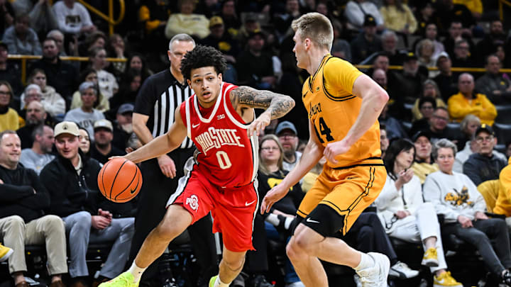Feb 25, 2026; Iowa City, Iowa, USA; Ohio State Buckeyes guard John Mobley Jr. (0) controls the ball as Iowa Hawkeyes guard Bennett Stirtz (14) defends during the first half at Carver-Hawkeye Arena. Mandatory Credit: Jeffrey Becker-Imagn Images Feb 25, 2026; Iowa City, Iowa, USA; Ohio State Buckeyes guard John Mobley Jr. (0) controls the ball as Iowa Hawkeyes guard Bennett Stirtz (14) defends during the first half at Carver-Hawkeye Arena. Mandatory Credit: Jeffrey Becker-Imagn Images