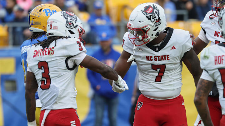 Oct 25, 2025; Pittsburgh, Pennsylvania, USA; North Carolina State Wolfpack tight end Justin Joly (7) celebrates with running back Hollywood Smothers (3) after scoring a touchdown against the Pittsburgh Panthers during the first quarter at Acrisure Stadium. Mandatory Credit: Charles LeClaire-Imagn Images