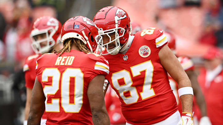 Dec 15, 2024; Cleveland, Ohio, USA; Kansas City Chiefs safety Justin Reid (20) and tight end Travis Kelce (87) greet each other before the game between the Cleveland Browns and the Chiefs at Huntington Bank Field. Mandatory Credit: Ken Blaze-Imagn Images