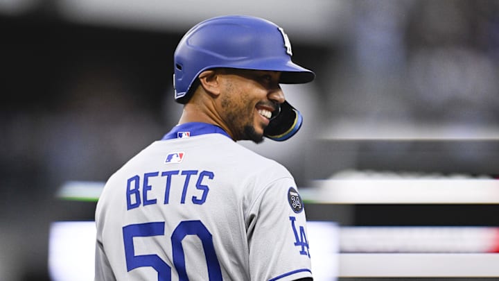 Jun 10, 2025; San Diego, California, USA; Los Angeles Dodgers shortstop Mookie Betts (50) smiles after walking during the third inning against the San Diego Padres at Petco Park. Mandatory Credit: Denis Poroy-Imagn Images