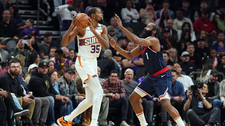 Jan 27, 2025; Phoenix, Arizona, USA; LA Clippers guard James Harden (1) guards Phoenix Suns forward Kevin Durant (35) during the second half at Footprint Center. Mandatory Credit: Joe Camporeale-Imagn Images