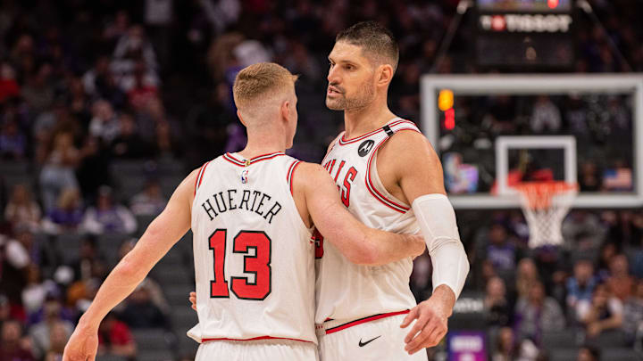 Mar 20, 2025; Sacramento, California, USA; Chicago Bulls guard Kevin Huerter (13) and center Nikola Vucevic (9) celebrate after defeating the Sacramento Kings at Golden 1 Center. Mandatory Credit: Ed Szczepanski-Imagn Images