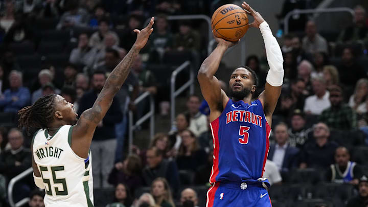 Nov 13, 2024; Milwaukee, Wisconsin, USA;  Detroit Pistons guard Malik Beasley (5) shoots against Milwaukee Bucks guard Delon Wright (55) during the third quarter at Fiserv Forum. Mandatory Credit: Jeff Hanisch-Imagn Images