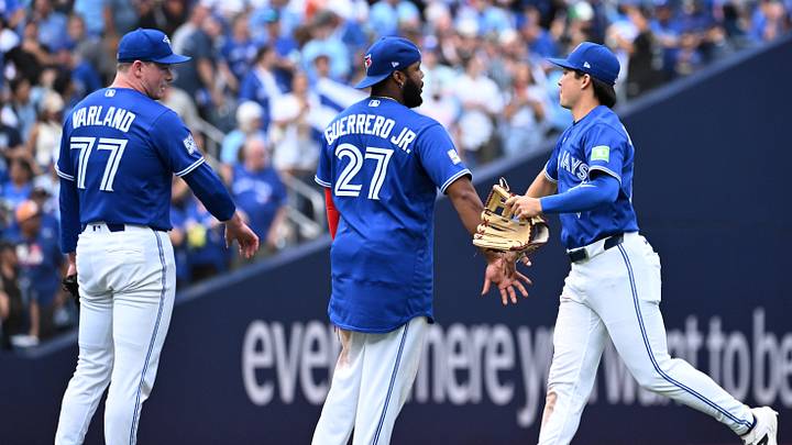 Sep 12, 2026; Toronto, Ontario, CAN; Toronto Blue Jays center fielder Brett Bateman (21) celebrates with first baseman Vladimir Guerrero Jr. (27) and relief pitcher Louis Varland (77) after a win over the Baltimore Orioles at Rogers Centre. Mandatory Credit: Dan Hamilton-Imagn Images Sep 12, 2026; Toronto, Ontario, CAN; Toronto Blue Jays center fielder Brett Bateman (21) celebrates with first baseman Vladimir Guerrero Jr. (27) and relief pitcher Louis Varland (77) after a win over the Baltimore Orioles at Rogers Centre. Mandatory Credit: Dan Hamilton-Imagn Images
