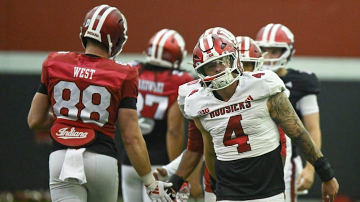 Indiana’s Sam West (88) slaps hands with linebacker Aiden Fisher (4) during spring practice on April 1, 2025.
