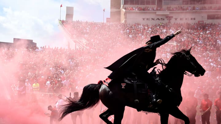 The Masked Rider runs out before the Texas Tech game against Houston. The Masked Rider runs out before the Texas Tech game against Houston.
