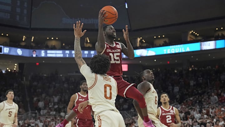 Mar 8, 2025; Austin, Texas, USA; Oklahoma Sooners guard Duke Miles (15) drives to the basket against Texas Longhorns guard Jordan Pope (0) during the second half at Moody Center. Mandatory Credit: Scott Wachter-Imagn Images