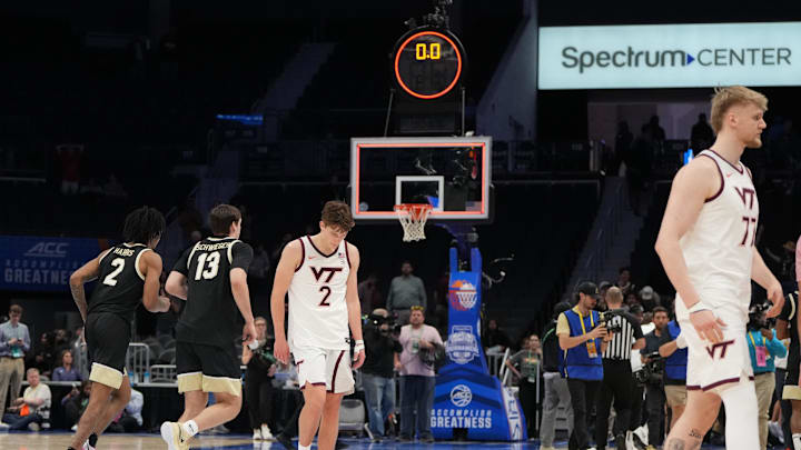 Mar 10, 2026; Charlotte, NC, USA; Wake Forest Demon Deacons forward Juke Harris (2) and forward Cooper Schwieger (13) and Virginia Tech Hokies guard Jaden Schutt (2) and center Antonio Dorn (77) react after the end of overtime at Spectrum Center. Mandatory Credit: Bob Donnan-Imagn Images
