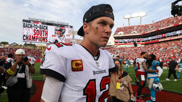 Jan 1, 2023; Tampa, Florida, USA;  Tampa Bay Buccaneers quarterback Tom Brady (12) celebrates after beating the Carolina Panthers at Raymond James Stadium. Mandatory Credit: Nathan Ray Seebeck-Imagn Images