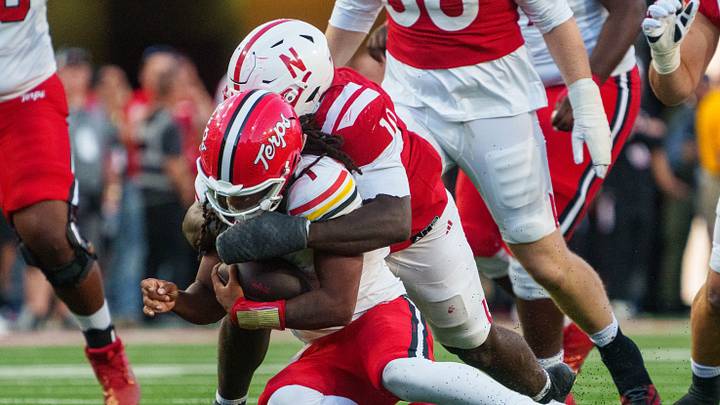 Maryland Terrapins quarterback Malik Washington (7) is sacked by Nebraska Cornhuskers linebacker Vincent Shavers Jr. (10) during the fourth quarter at Memorial Stadium. Maryland Terrapins quarterback Malik Washington (7) is sacked by Nebraska Cornhuskers linebacker Vincent Shavers Jr. (10) during the fourth quarter at Memorial Stadium.