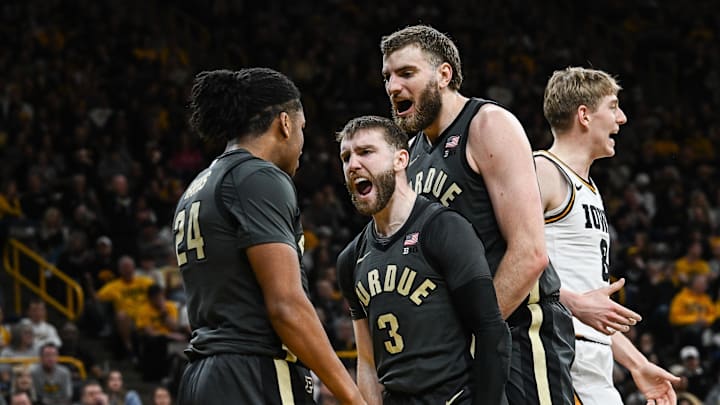 Purdue Boilermakers guard Gicarri Harris (24) and guard Braden Smith (3) and center Oscar Cluff (right center)