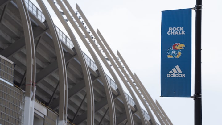 A Kansas banner shows a Jayhawk and branding against the new David Booth Kansas Memorial Stadium on April 16, 2025. A Kansas banner shows a Jayhawk and branding against the new David Booth Kansas Memorial Stadium on April 16, 2025.