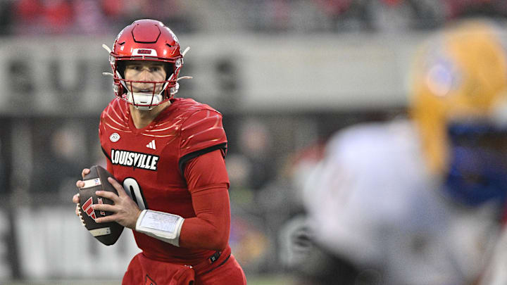 Nov 23, 2024; Louisville, Kentucky, USA;  Louisville Cardinals quarterback Tyler Shough (9) looks to pass against the Pittsburgh Panthers during the first half at L&N Federal Credit Union Stadium. Mandatory Credit: Jamie Rhodes-Imagn Images
